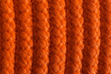 Texture of orange wicker mat as background, top viewの写真素材