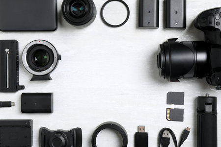 Camera and video production equipment on light background, flat lay. Space for textの写真素材