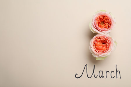 8 March greeting card design with roses and space for text on beige background, flat lay. International Women's dayの写真素材