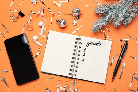 Word Goals in notebook, new aims. Objects on orange background, flat layの写真素材