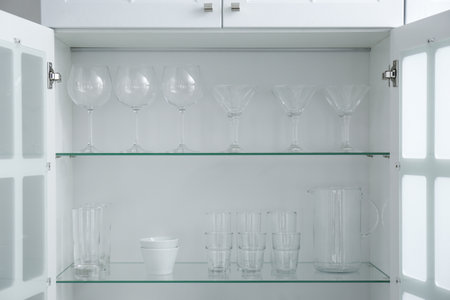 Cabinet with crockery and glassware. Order in kitchenの写真素材