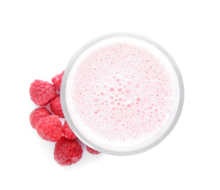 Tasty fresh milk shake with raspberries on white background, top viewの写真素材