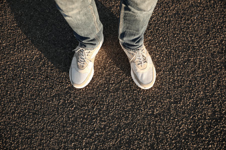 Man standing on road, closeup with space for text. Choosing way conceptの写真素材