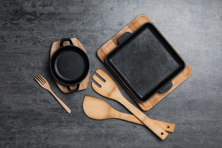 Set of cooking utensils on gray table, flat layの写真素材