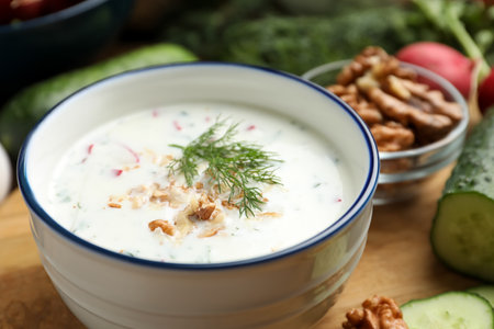 Delicious cold summer soup on wooden board, closeupの写真素材