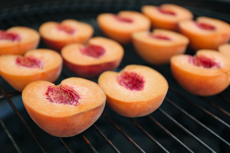 Modern grill with tasty cut peaches, closeupの写真素材
