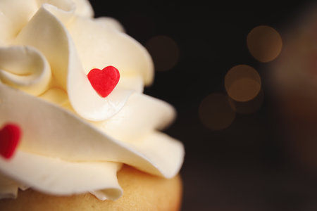 Tasty sweet cupcake on blurred background, closeup view with space for text. Happy Valentine's Dayの写真素材
