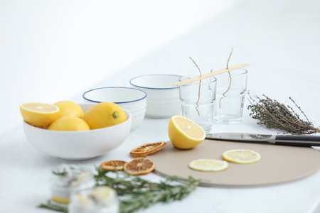 Ingredients for natural homemade mosquito repellent candles on white tableの写真素材