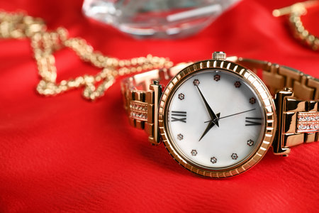 Luxury wrist watch on red background, closeupの写真素材