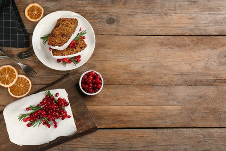 Flat lay composition with traditional classic Christmas cake on wooden table. Space for textの写真素材