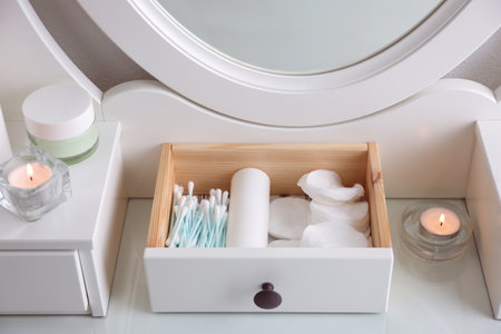 Drawer with cotton buds and pads in dressing tableの写真素材
