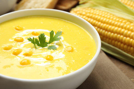 Delicious creamy corn soup in bowl, closeupの写真素材