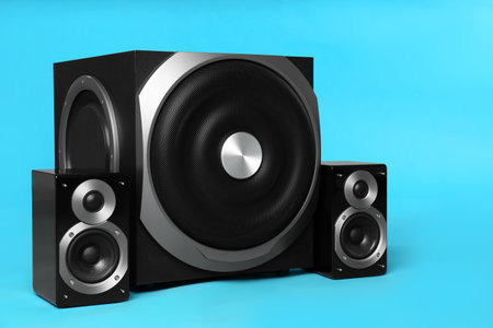 Modern powerful audio speaker system on light blue backgroundの写真素材