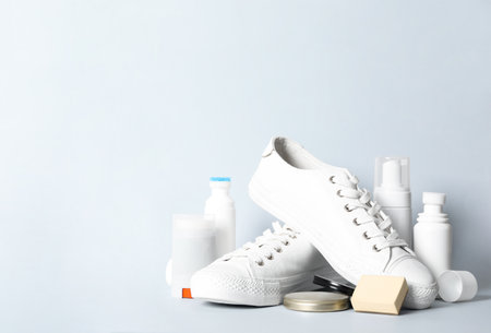 Composition with stylish footwear and shoe care accessories on white backgroundの写真素材