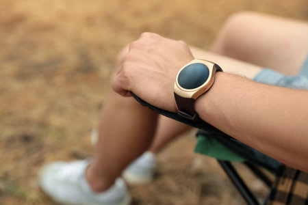 Man with stylish smart watch outdoors, closeupの写真素材