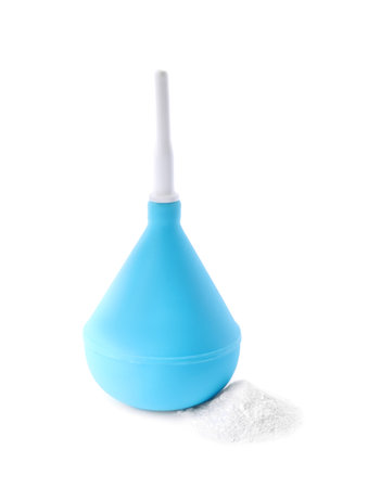 Blue enema and soda powder on white backgroundの写真素材