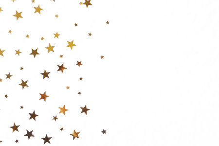 Star shaped golden confetti on white background, top viewの写真素材