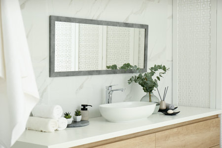 Modern bathroom interior with stylish mirror and vessel sinkの写真素材