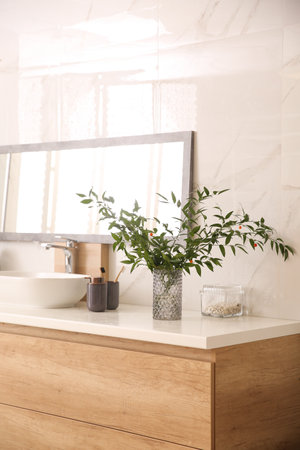 Modern bathroom interior with stylish mirror and vessel sinkの写真素材