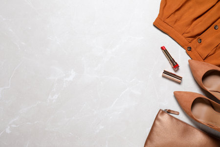 Flat lay composition with stylish clothes and accessories on marble background, space for textの写真素材