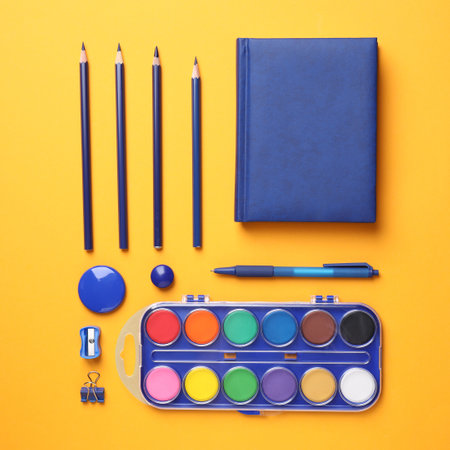 Different stationery on orange background, flat layの写真素材