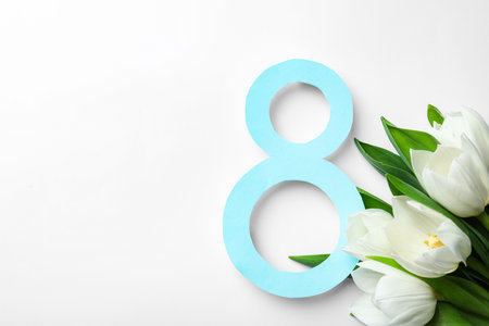 8 March greeting card design with tulips on white background, top view. Space for textの写真素材