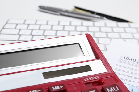 Calculator, keyboard and document on table, closeup. tax accountingの写真素材