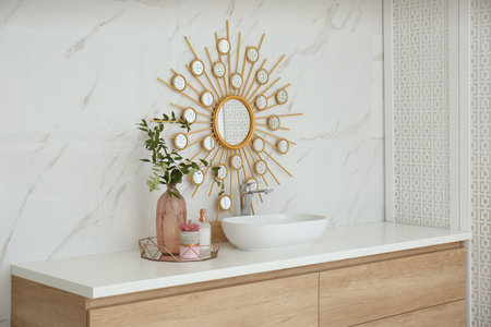 Modern bathroom interior with stylish mirror and vessel sinkの写真素材