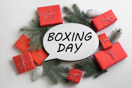 Speech bubble with phrase BOXING DAY and Christmas decorations on white background, flat layの写真素材