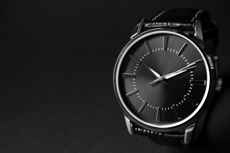 Luxury wrist watch on black background, closeup. Space for textの写真素材