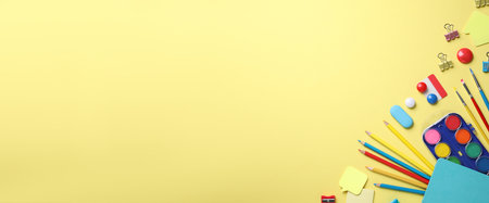 Different stationery on yellow background, flat lay. Space for textの写真素材