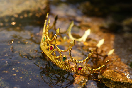 Beautiful golden crown near the river, closeup. fantasy itemの写真素材