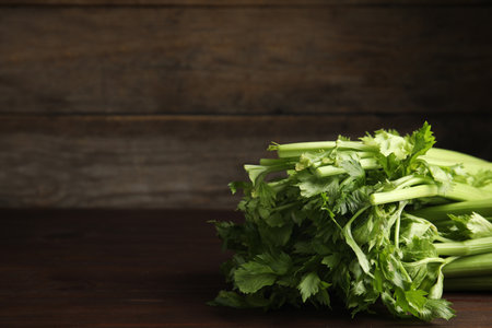 Fresh ripe green celery on wooden table. Space for textの写真素材