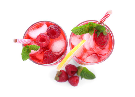 Different delicious lemonades made with soda water and ingredients on white background, top viewの写真素材