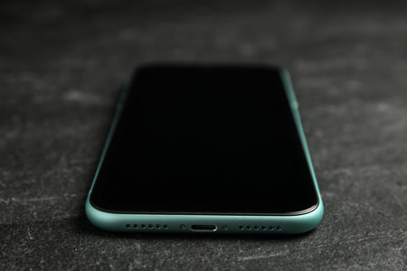 MYKOLAIV, UKRAINE - JULY 9, 2020: New modern Iphone 11 on black background, closeupのeditorial素材