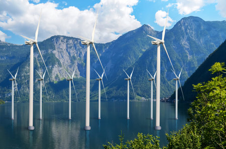 Floating wind turbines installed in water near mountains. alternative energy sourcesの写真素材