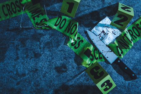 Flat lay composition with evidence and crime scene markers on stone background at night