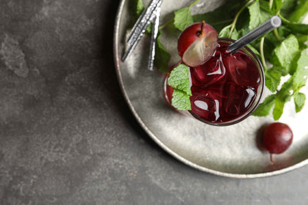 Delicious grape soda water with mint on gray table, top view. Refreshing drinksの写真素材