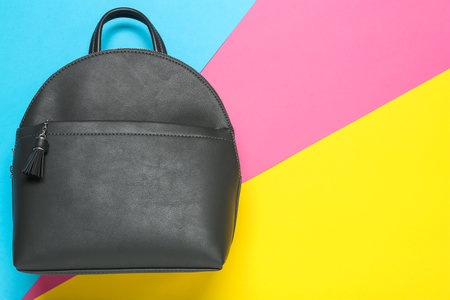 Stylish urban backpack on color background, top view. Space for textの写真素材