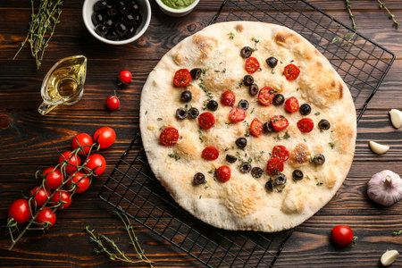 Flat lay composition with focaccia bread on wooden tableの写真素材