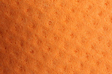 Orange foam rubber as background, top viewの写真素材