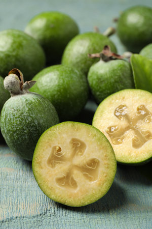 Fresh green feijoa fruits on blue wooden table, closeupの写真素材