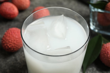 Fresh lychee juice on gray table, closeupの写真素材