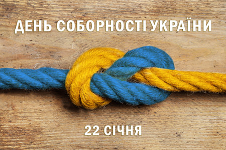 Unity Day of Ukraine poster design. Color ropes tied together, map and text written in Ukrainian on...