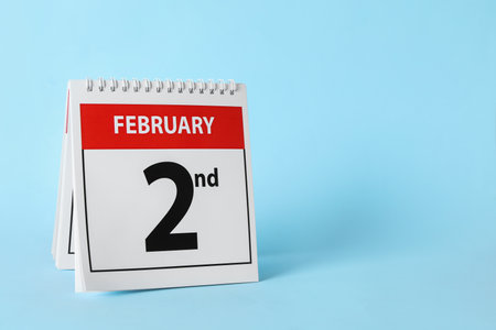 Calendar with date February 2nd on light blue background, space for text. Groundhog dayの写真素材