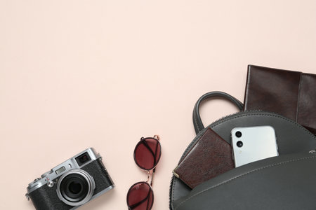 Flat lay composition with stylish backpack on beige background, space for textの写真素材