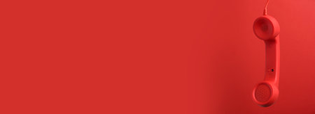 hotline service. Telephone receiver and space for text on red background, banner designの写真素材