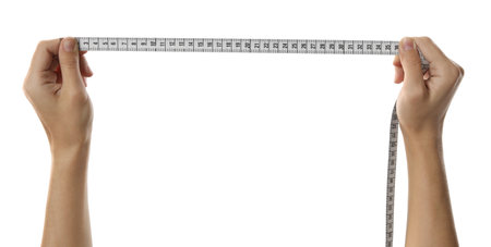 Woman holding measuring tape on white background, closeup