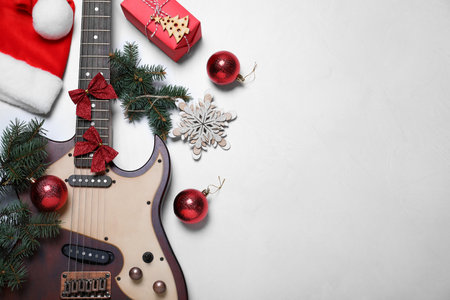 Guitar and festive decorations on white background, flat lay with space for text. christmas musicの写真素材