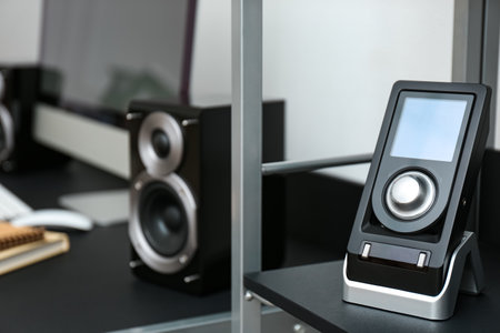 Modern audio speaker and remote control indoorsの写真素材